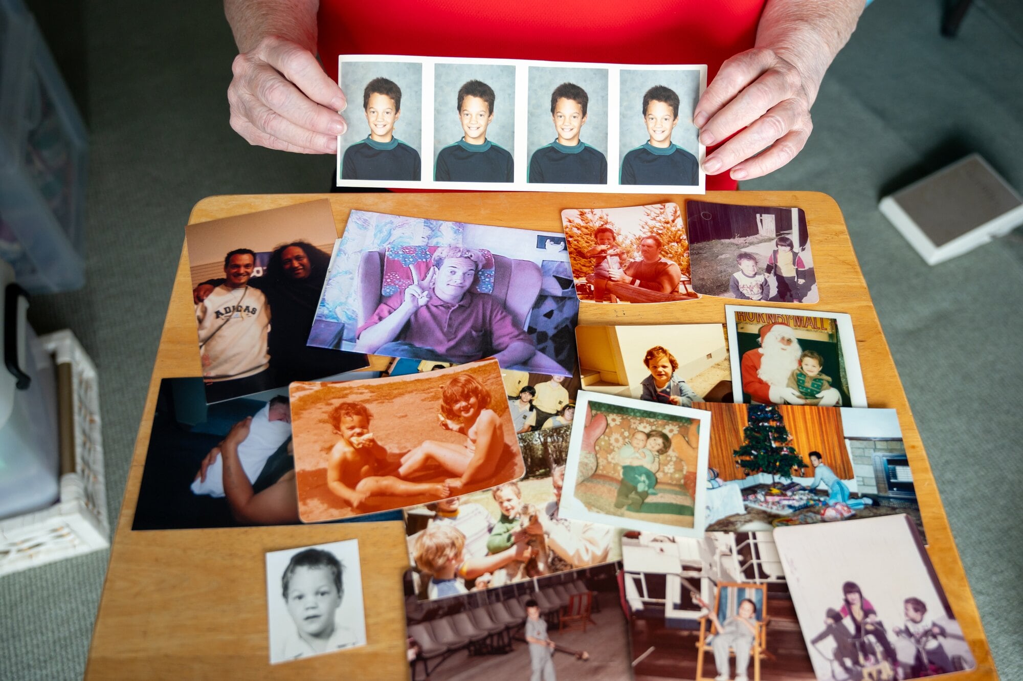  Tauranga retiree Carol Hudson with photos of Gary from his childhood. Photo / Brydie Thompson