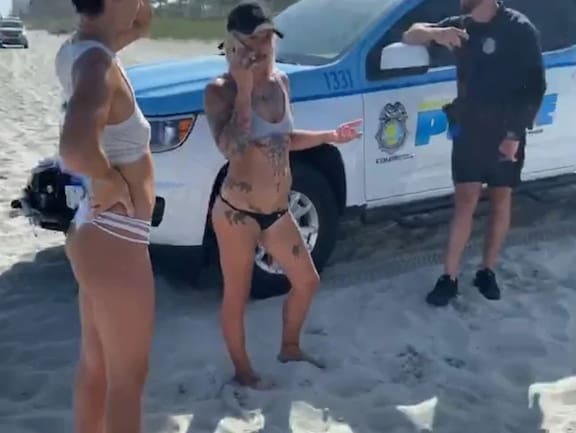 KREA - a beautiful woman in bikini with big breasts in a prision cell  arrested