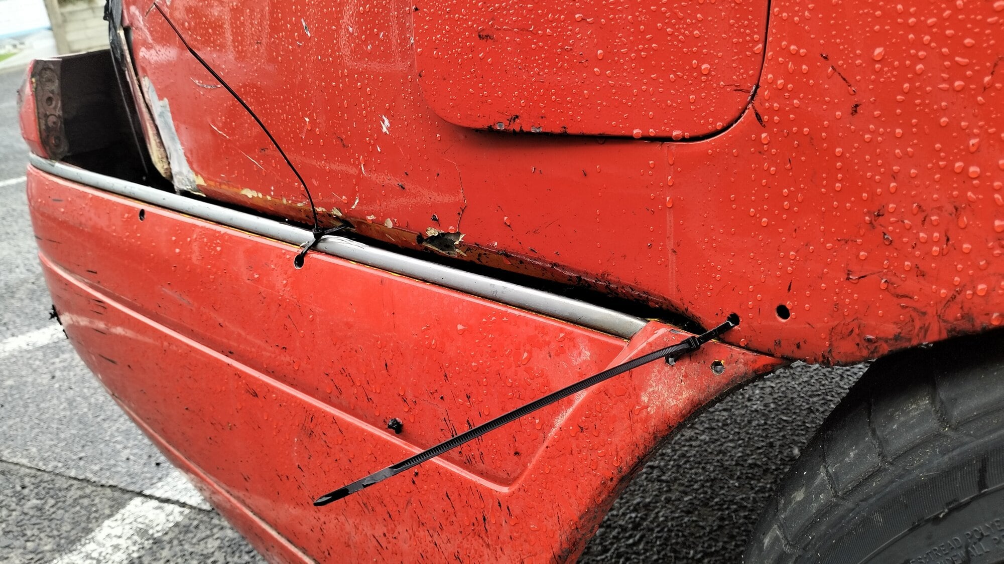  The back of Zac Green's car which was damaged during the last round of the D1NZ series has cable ties helping keep panels together until repairs are done. Photo/Rosalie Liddle Crawford.