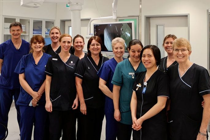 Endoscopist Adrian Claydon with some of Grace’s specialist endoscopy nurses and technicians in one of Grace’s newly refurbished endoscopy procedure rooms. Photo: Supplied.