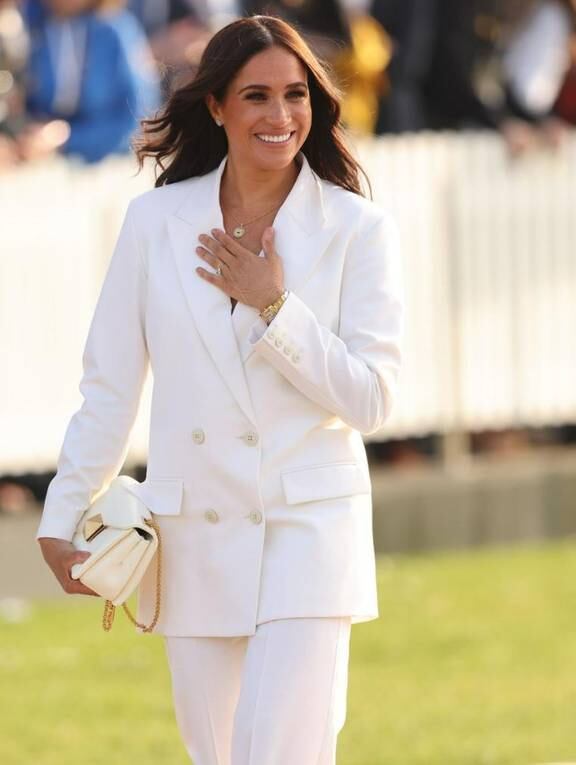 Meghan's VERY high-end brunch look! Duchess of Sussex sports £10,000 outfit