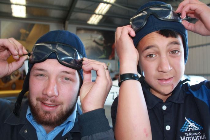 Te Kura o Manunui Matua Kaydin Budd and Year 6 student Asher Matthews try out the gear at Skydive Tauranga ahead of their jump. Photo/Debbie Griffiths.